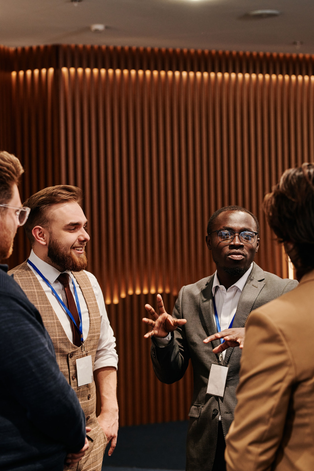 An African professional in conversation with international colleagues